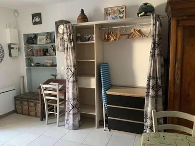 a room with a desk and a table and a closet at Le Yodala - Lamanon in Lamanon