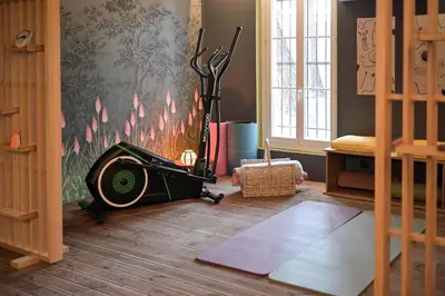 a room with a room with a machine on the floor at La Villa KEF - Domaine & Golf de Pont Royal in Mallemort