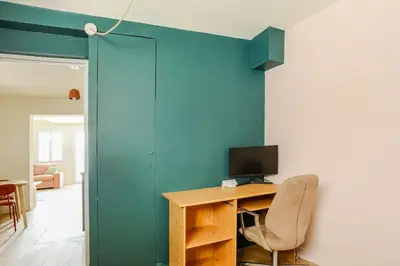 a room with a desk with a monitor and a chair at Cocoon et style - proche du centre in Aix-en-Provence