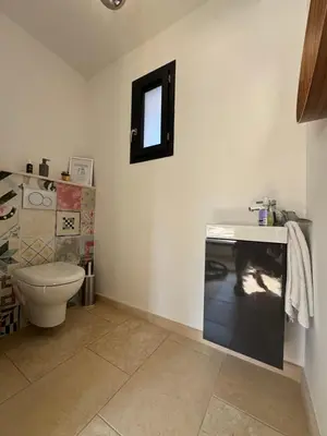 a bathroom with a toilet and a sink at Villa Cali-Provence in Le Puy-Sainte-Réparade