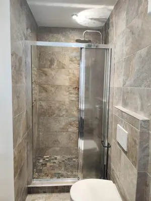 a bathroom with a shower and a toilet at Aix Centre-ville in Aix-en-Provence