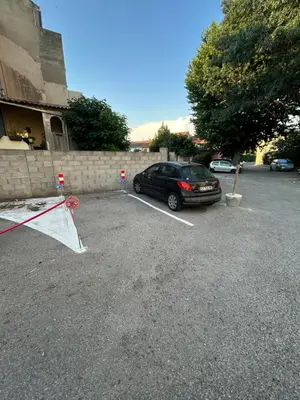a car parked in a parking lot next to a building at T2 centre-ville avec parking privé inclus in Cavaillon