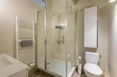 a bathroom with a shower and a toilet and a sink at Beautiful 3 bedrooms in a detached house in Aix-en-Provence
