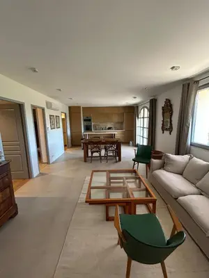 a living room with a couch and a table at Bastidon provençal entièrement rénové et climatisé in Vaugines