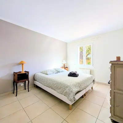 a cup of coffee on a table with a camera at L'Oliveraie - Maison Familiale avec Piscine privée - Clim - Wifi - 4 Chambres - 3 Salle de Bains in Jouques