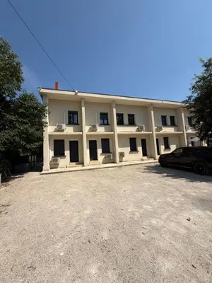 a building with a car parked in front of it at Appart hotel bonpas in Noves