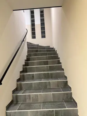 a staircase in a building with concrete steps at Appart hotel bonpas in Noves