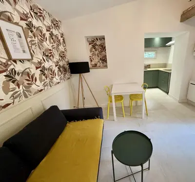 a living room with a couch and a table at Domaine Saint Roch in Saint-Paul-lez-Durance