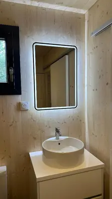 a bathroom with a sink and a mirror on the wall at Cabane dans le Luberon - Bird in Provence in Cavaillon