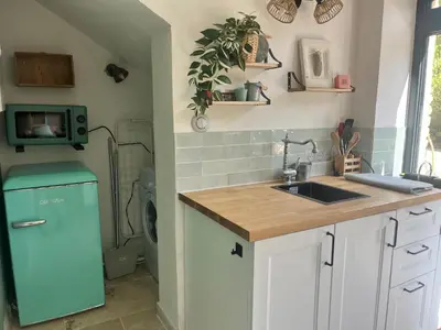 a toaster sitting on a counter in a kitchen at Aix-en-Provence, Cosy studio au calme de la campagne avec Spa et Clim in Aix-en-Provence