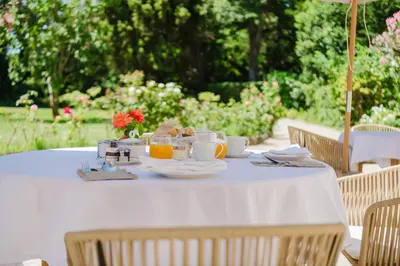 a white table with food and drinks on it at Château Saint Perret in Avignon