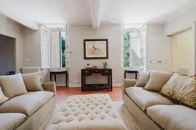 a living room with two couches and a table at Château Saint Perret in Avignon