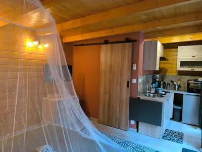 a wedding veil is hanging in a kitchen at Evasion sous les pins in Aurons