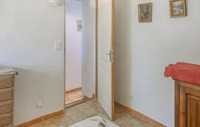 a room with a closet with a door in it at Maison Avec Piscine in La Tour-dʼAigues