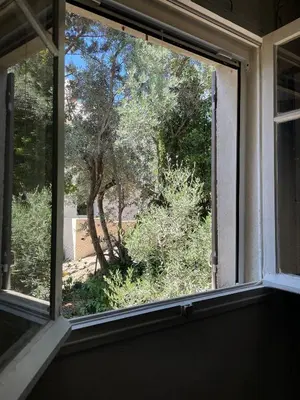 a garden with trees and a stone walk way at Rando Luberon en famille, centre d'Apt à pied in Apt