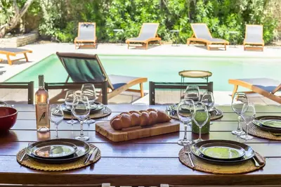 two pictures of a chair next to a pool at LOasis de Gordes Provence Pool Villa Retreat in Gordes
