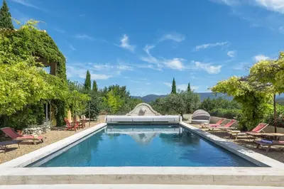an image of a swimming pool with chairs and trees at Le Mas Jorel Luxury Pool Villa with Mountain View in Gargas