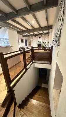 a stairway in a house with a balcony at Art Appartement Kristina 80m2 in Graminier