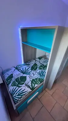 a shelf with a bed in a room at Art Appartement Kristina 80m2 in Graminier