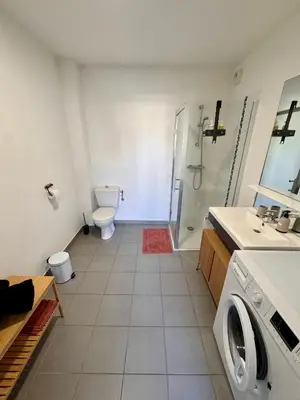 a bathroom with a toilet a sink and a shower at Terrasse, clim et piscine à Aix-en-Provence in Aix-en-Provence