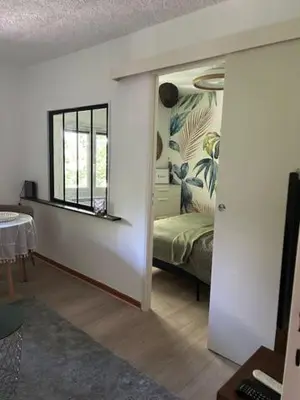 a room with a bedroom with a bed and a window at Cocon douillet près du Cours Sextius in Aix-en-Provence