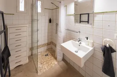a white bathroom with a sink and a shower at Mas Provençal au Cœur des Vignes du Luberon - 3 Chambres - Calme Absolu - Wifi in La Tour-dʼAigues