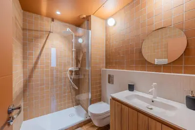 a bathroom with a shower and a toilet and a sink at Appartement Belle Lettre 7 in Aix-en-Provence