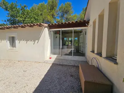 an entrance to a house with a glass door at Villa sous les pins in Ventabren