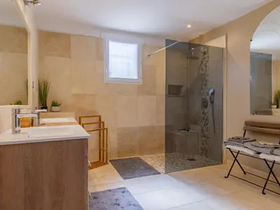 a bathroom with a shower and a sink at Villa A l'Ombre du Soleil by Interhome in Monteux
