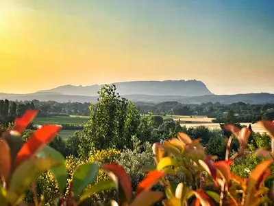 a view of a field with mountains in the background at Le Moulin in Aix-en-Provence