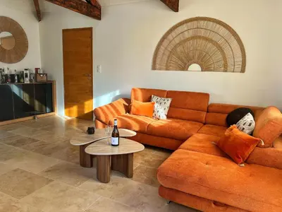 a living room with a couch and a table at Le Moulin in Aix-en-Provence