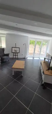 a living room with a couch and a table at Appartement T3 Refait a neuf in Mazan