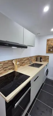 a kitchen with a stove and a sink at Appartement T3 Refait a neuf in Mazan