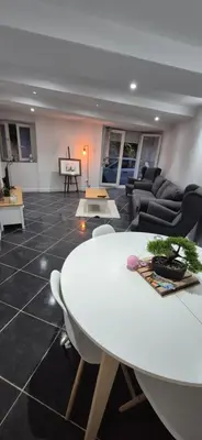 a living room with a white table and a couch at Appartement T3 Refait a neuf in Mazan
