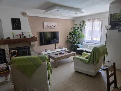 a living room with a couch and a fireplace at Villa avec piscine privée in Alleins