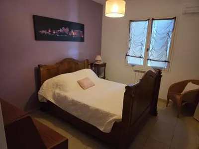a small bedroom with a bed and a window at Villa avec piscine privée in Alleins