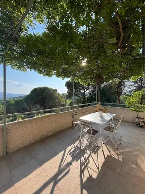 a white table and chairs on a patio at Lourmarin Family Country House in Cadenet