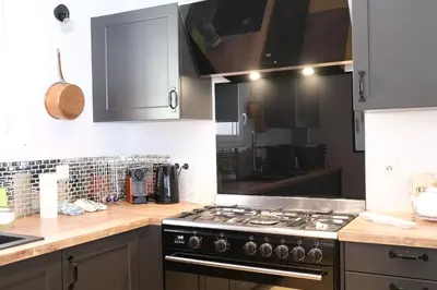 a kitchen with a stove and a counter top at Luxury air-conditioned villa pool views Aix-en-Provence LS7-457 in Saint-Cannat