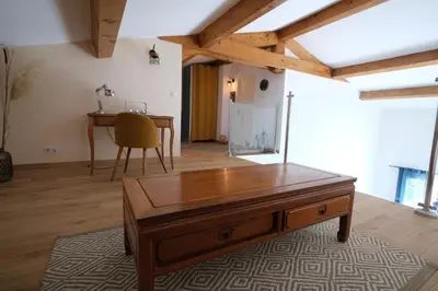 a living room with a wooden table and a desk at Luxury air-conditioned villa pool views Aix-en-Provence LS7-457 in Saint-Cannat
