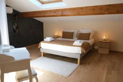 a bedroom with a bed and two lights on two tables at Luxury air-conditioned villa pool views Aix-en-Provence LS7-457 in Saint-Cannat