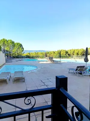 a view of a swimming pool from a balcony at Domaine de Pont royal in Mallemort