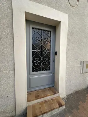 a door with a black door handle on a door with a door at L'Échappée Belle Studio in Châteaurenard