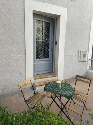 a bathroom with a toilet and a glass shower at L'Échappée Belle Studio in Châteaurenard