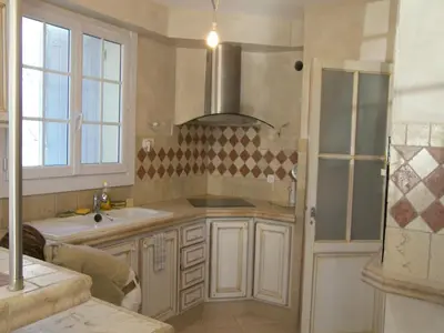 a kitchen with a sink and a stove top oven at Villa in Reillanne with Private Pool in Reillanne