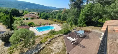 an aerial view of a house with a swimming pool at La Colline sous les etoiles in Lincel