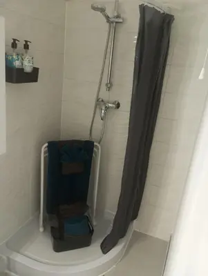 a bathroom with a shower with a shower curtain at Evasion Aixoise logement T2 au Centre historique in Aix-en-Provence