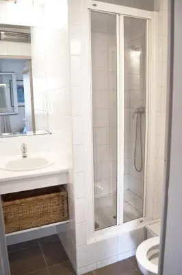 a bathroom with a shower and a sink and a toilet at Charmant appart central avec Terrasse & Clim in Aix-en-Provence