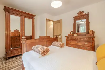 a bedroom with a bed and a dresser and a mirror at La Mathilde - Premium Pool Villa Private Tree-Top Adventure in Bonnieux