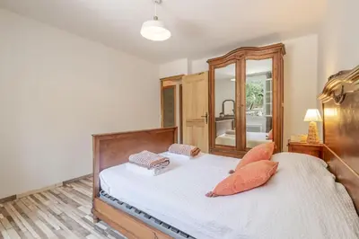 a bedroom with a bed with two pillows on it at La Mathilde - Premium Pool Villa Private Tree-Top Adventure in Bonnieux