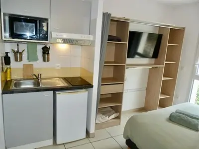 a small kitchen with a sink and a microwave at Le Clos d'AIX Studio 113 in Aix-en-Provence